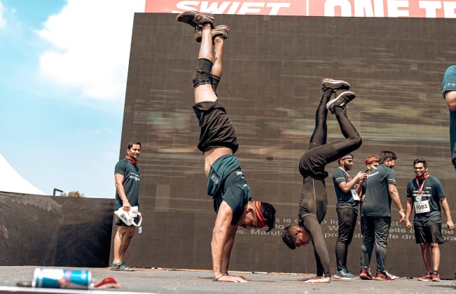 Participants performing handstands